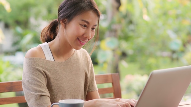 freelance asian woman working home busines